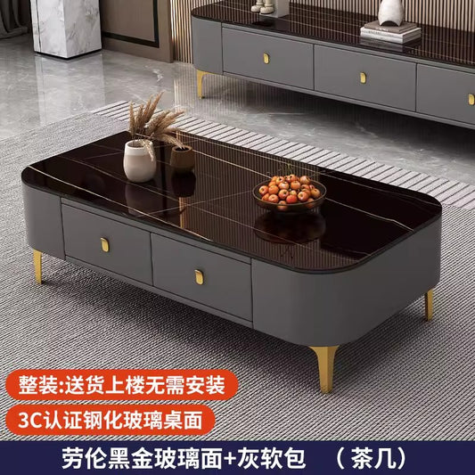 Modern rectangular coffee table featuring a white faux-marble tabletop, orange upholstered storage drawers, and gold legs